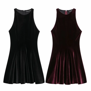 Close-up of elegant sleeveless velvet dresses in black and burgundy with pleated hem