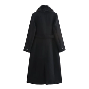 Women's long black wool coat with faux fur collar and waist belt from rear view