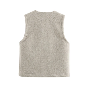 Rear view of oatmeal textured faux shearling vest featuring a minimalist sleeveless cut