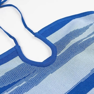 Detailed close-up of blue striped knit texture and halter neck drawstring craftsmanship