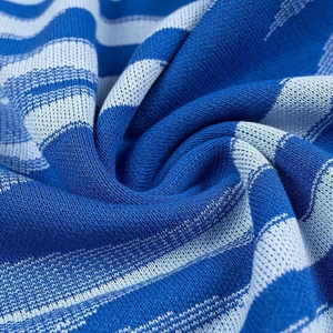 Close-up of blue and white striped knit fabric showing texture and soft drape detail
