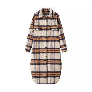 Detailed view of plaid shirt jacket texture with buttons and soft brushed fabric