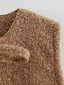 Close-up of the premium camel teddy fleece fabric texture and stitching on the vest