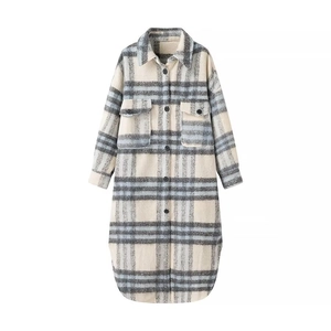 Detail of grey and blue plaid pattern long shacket with breast pockets and buttons