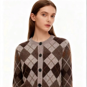 Women's vintage argyle knit cardigan featuring brown and grey diamond patterns with buttons
