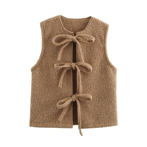 Toddler girl warm brown sherpa vest with three cute bow closures in minimalist style