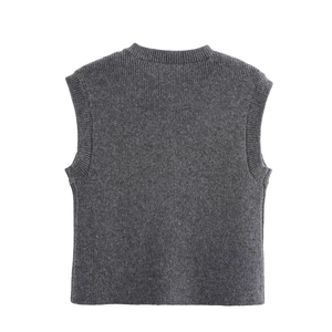 Close-up of charcoal grey knitted vest featuring ribbed edges and vertical textures