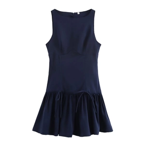 Detail of navy blue sleeveless dress featuring waist drawstring and ruffled hemline