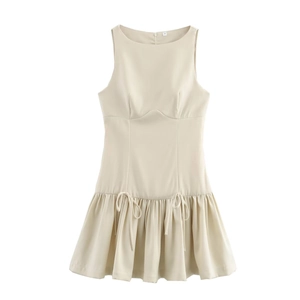 Detailed view of apricot sleeveless dress featuring round neck and waist bow ties