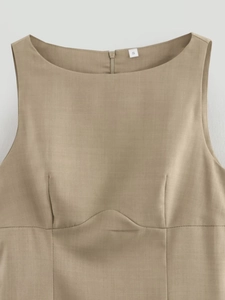 Detail view of khaki sleeveless dress featuring structured stitching and size S label