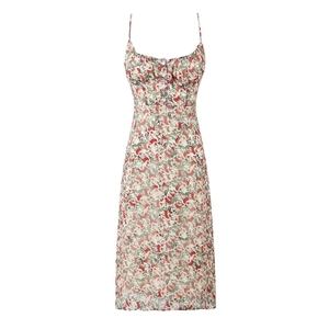 Detail of floral spaghetti strap dress with ruffled neckline and decorative white buttons