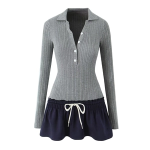 Detail of grey ribbed knit polo bodice and navy mini skirt with white drawstring tie