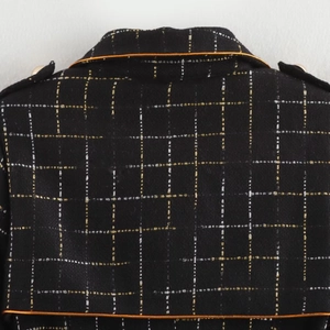 Elegant black tweed coat for women with classic plaid pattern and gold metallic accents
