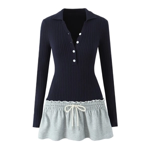 Detailed view of the rib-knit polo collar and white buttons on a two-piece splice dress