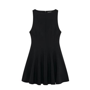 Detailed close-up of a black sleeveless A-line dress with pleated skirt and round neck