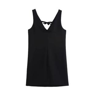 Sleeveless black velvet mini dress with a V-neck and a decorative bow tie on the back