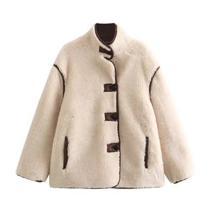 Women's cream faux shearling jacket with brown leather trim and button closure