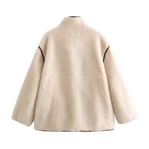Back view of a cream faux fur jacket with stylish brown piping and boxy silhouette