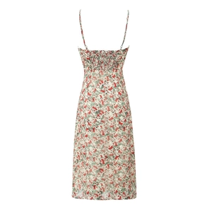 Back view of white floral camisole dress with red flower print and elastic back design