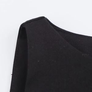 Macro shot of black twill fabric texture and high-quality stitching on the shoulder strap
