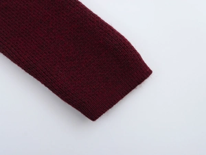 Close-up of the burgundy knit cuff showing detailed texture and high-quality stitching