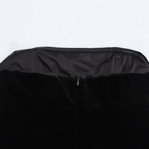 Detail shot of the back hidden zipper and silk texture of the black off-shoulder dress