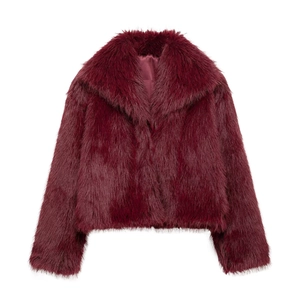 Detail of burgundy faux fur coat showing plush texture and oversized notched collar