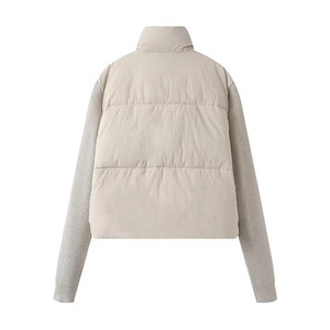 Women's chic beige puffer jacket with quilted body and knitted sleeves back view