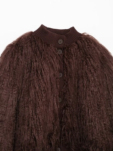 Detailed close-up of dark brown faux fur knit cardigan with textured plush finish and buttons
