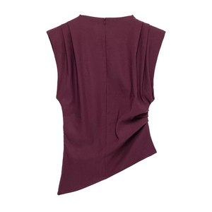 Detail of dark purple sleeveless top with shoulder pleats and asymmetrical hemline