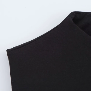 Detailed view of neckline and stitching on a black elegant belt dress for women