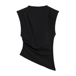Detail of black sleeveless asymmetric top featuring gathered shoulder and ruched side pleats