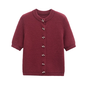 Short-sleeved dark red knit cardigan with silver bow buttons and a fuzzy mohair texture