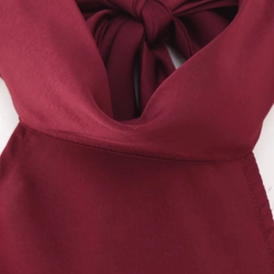 Elegant halter neck satin maxi dress in deep burgundy with a refined silk texture finish
