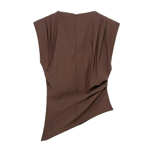 Detail of a brown sleeveless top with structured shoulders and asymmetrical hemline