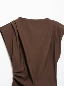 Detail of dark brown sleeveless top featuring pleated shoulder design and textured fabric