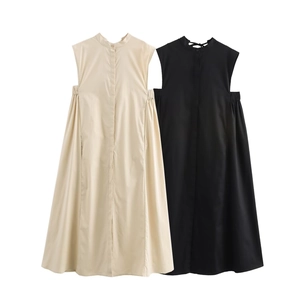 Detail of sleeveless midi dress showing high neck and gathered elastic side panels