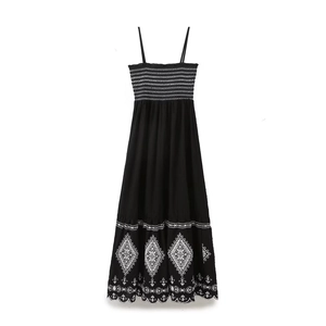Elegant black maxi dress with white shirred bodice and diamond embroidery details