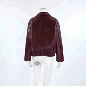 Rear view of a burgundy faux leather jacket featuring a classic collar and elastic hem