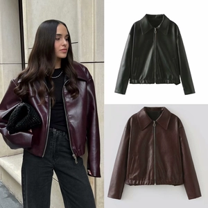 Detail of the elasticized hem and zipper on this women's lapel faux leather biker jacket
