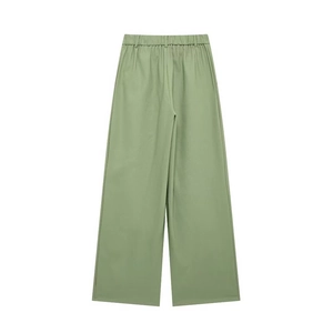 Vue détaillée du dos d'un pantalon large vert clair à taille haute avec ceinture élastique