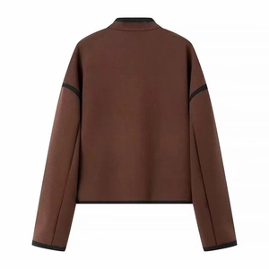 Back view of minimalist dark brown wool jacket with black contrast piping and stand collar