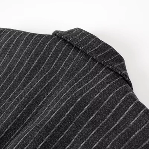 Close-up of stylish grey pinstripe knitted coat showing collar detail and fabric texture