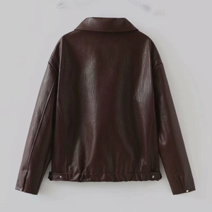 Detail view showing dark brown leather jacket back with elastic hem and metal buckle adjustment