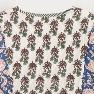 Quilted floral jacket with dual-side print and contrast piping trim detail
