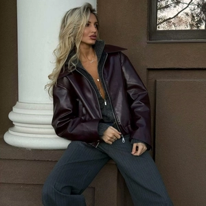Chic burgundy faux leather jacket with oversized lapels and metal zipper closure
