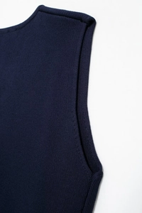 Detail of navy blue ribbed knit tank top showing high-quality fabric texture and stitching