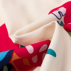 Detail of colorful abstract print on silky chiffon fabric with soft elegant draping