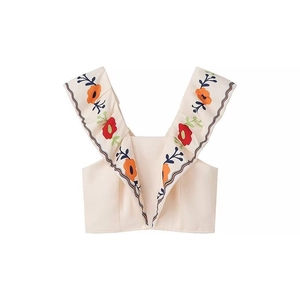 Women's cream v-neck cropped vest top with colorful floral embroidery on ruffled straps