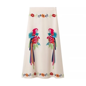 Women bohemian white midi skirt featuring colorful parrot embroidery and floral patterns